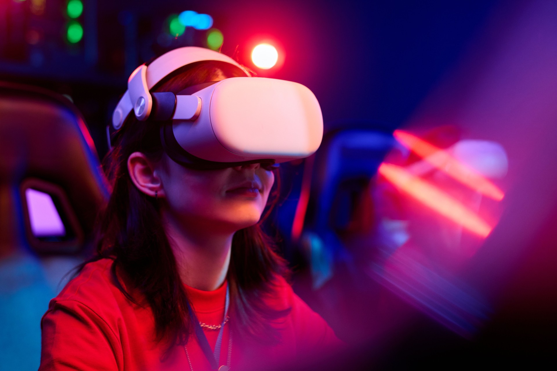 Teenage Caucasian Girl Using Virtual Reality Headset While Gaming in Team