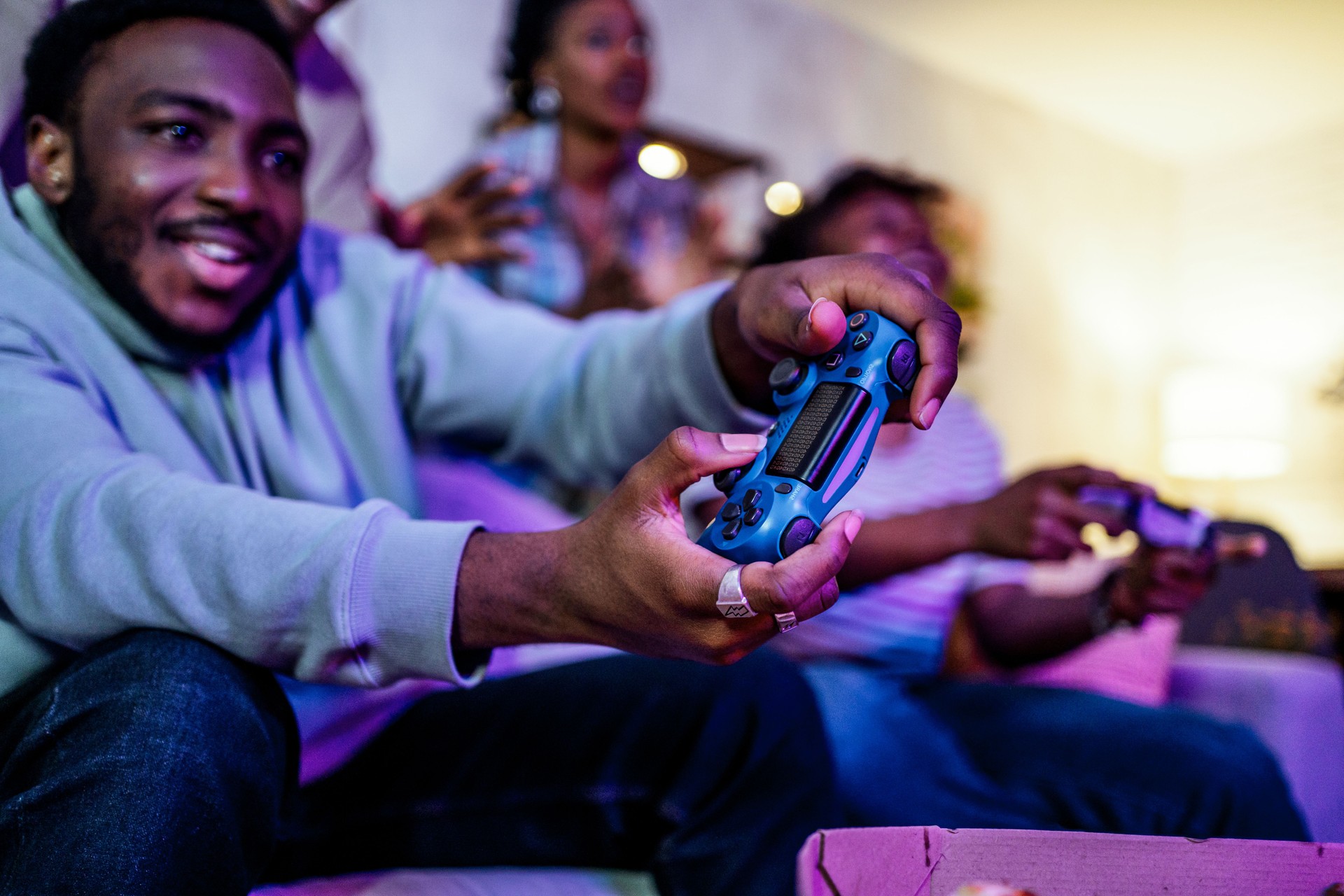 Friends playing video games at night